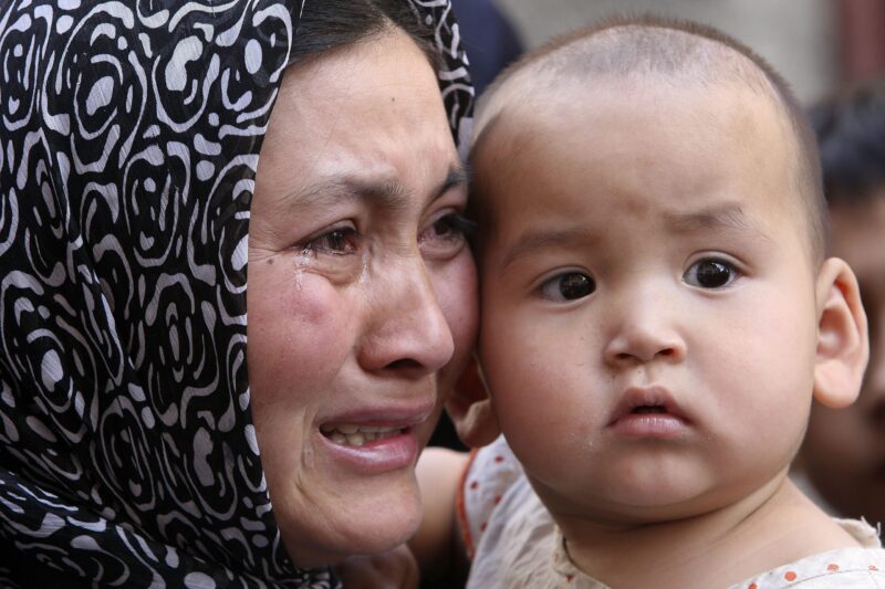 Uyghur woman with child