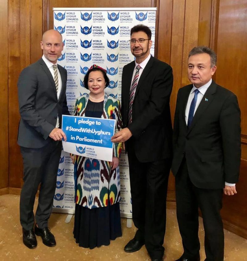 Standing with Stephen Kinnock MP, Rahima Mahmut and Dolkun Isa