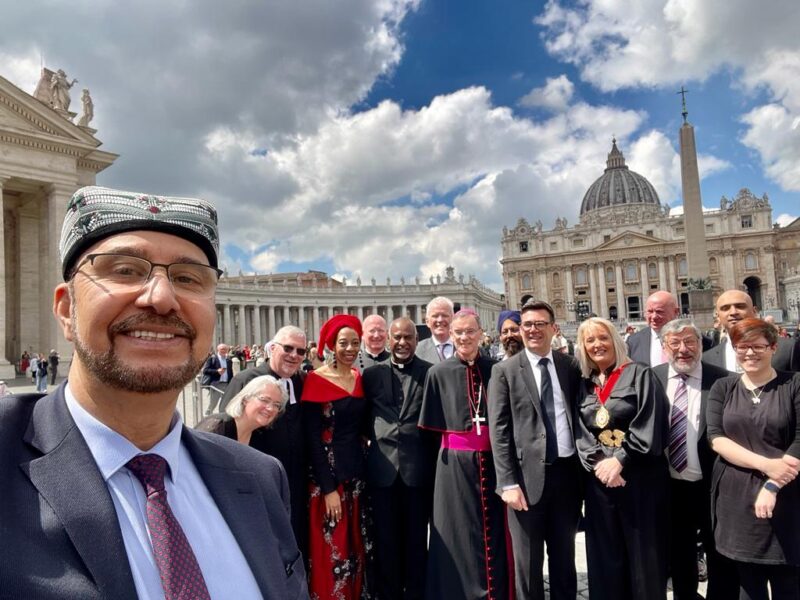 Afzal Khan MP taking a selfie outside the Vatican with other delegates