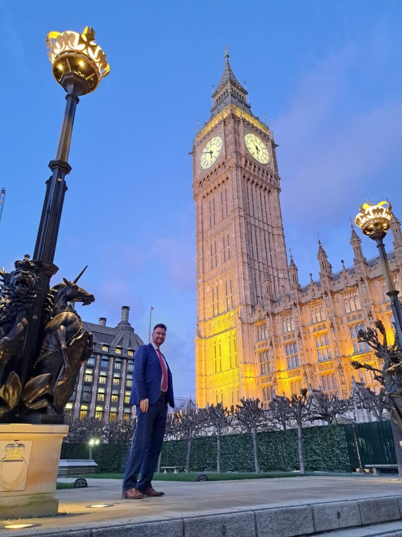 Afzal Khan MP standing in front of Big Ben